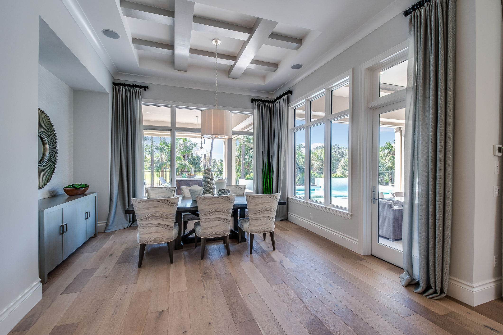 Interior wall painting dining room with coffered ceiling.