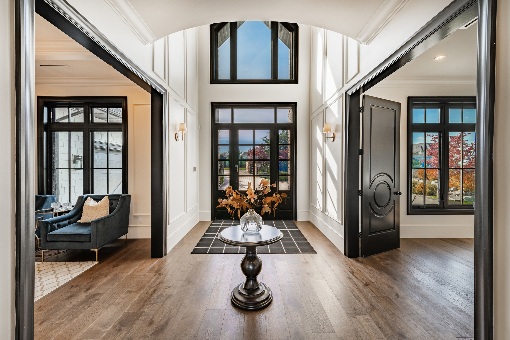 High-contrast black and white foyer paint and trim work.